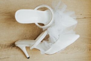 The Mule Heel Is Quietly Edging Out the Strappy Sandal A pair of beige mule heels on a clean surface, showing the open-back closed-toe silhouette