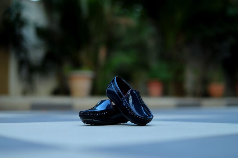The Kitten Heel Loafer Is Quietly Edging Out the Block-Toe Flat A pair of sleek kitten heel loafers on a light surface