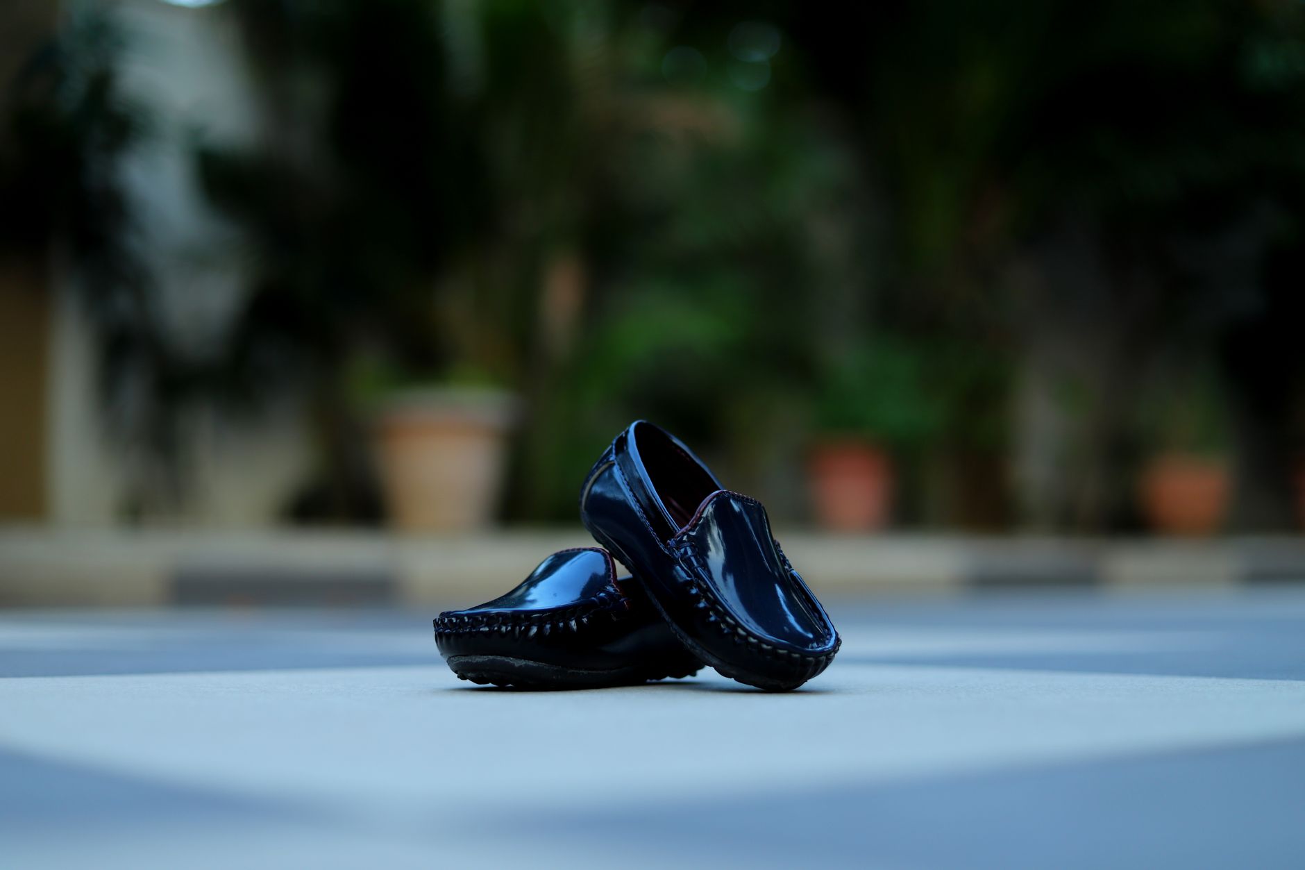 A pair of sleek kitten heel loafers on a light surface