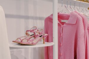 The Kitten Heel Slingback Is Quietly Edging Out the Block-Heel Pump A row of women's heels displayed on a shoe rack, including slingback and pump styles