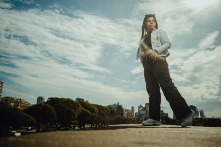 The Capri Pant Is Quietly Edging Out the Cropped Wide-Leg Woman wearing tailored cropped trousers styled with a fitted blazer