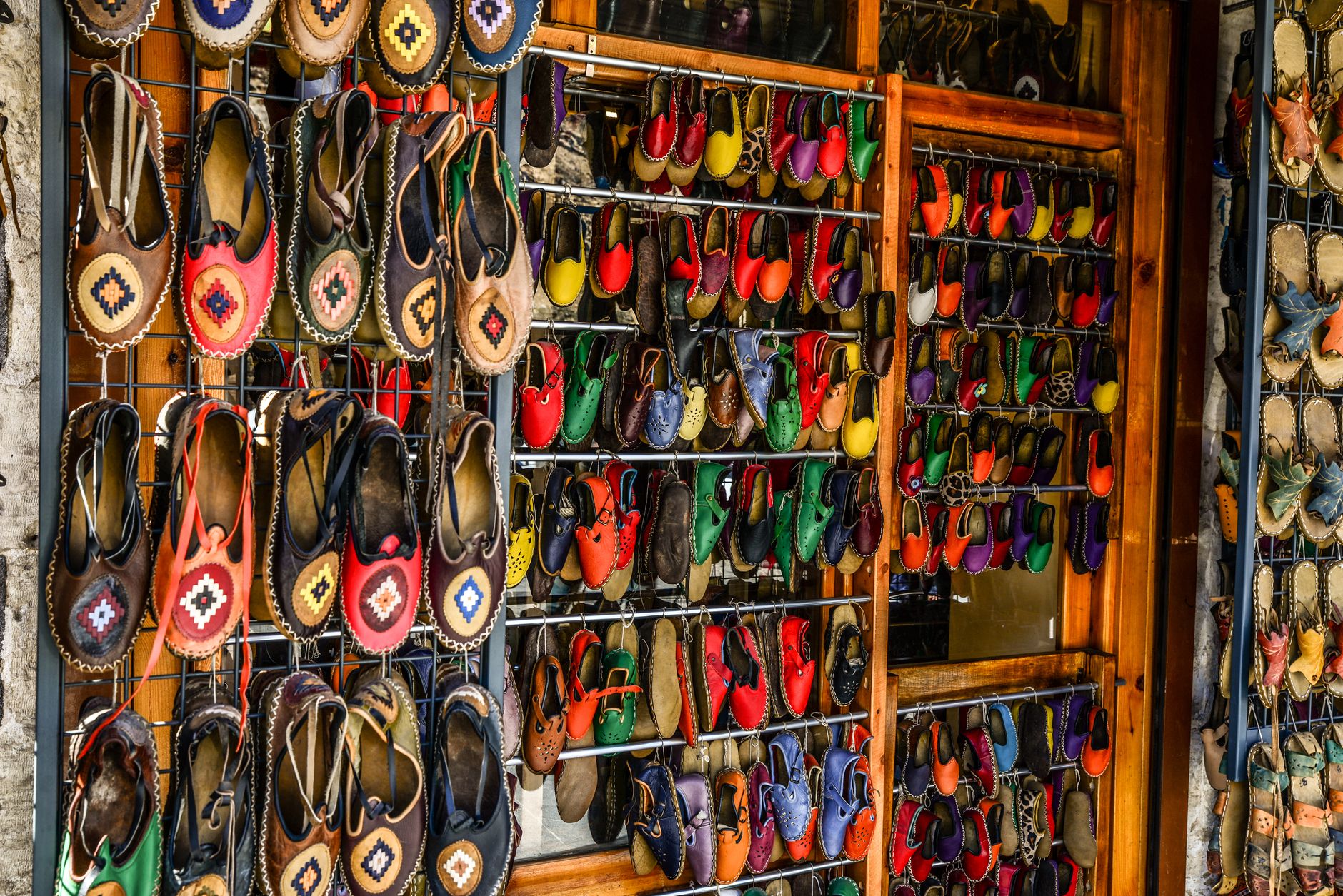 Loafers and flat shoes displayed on a minimalist retail shelf