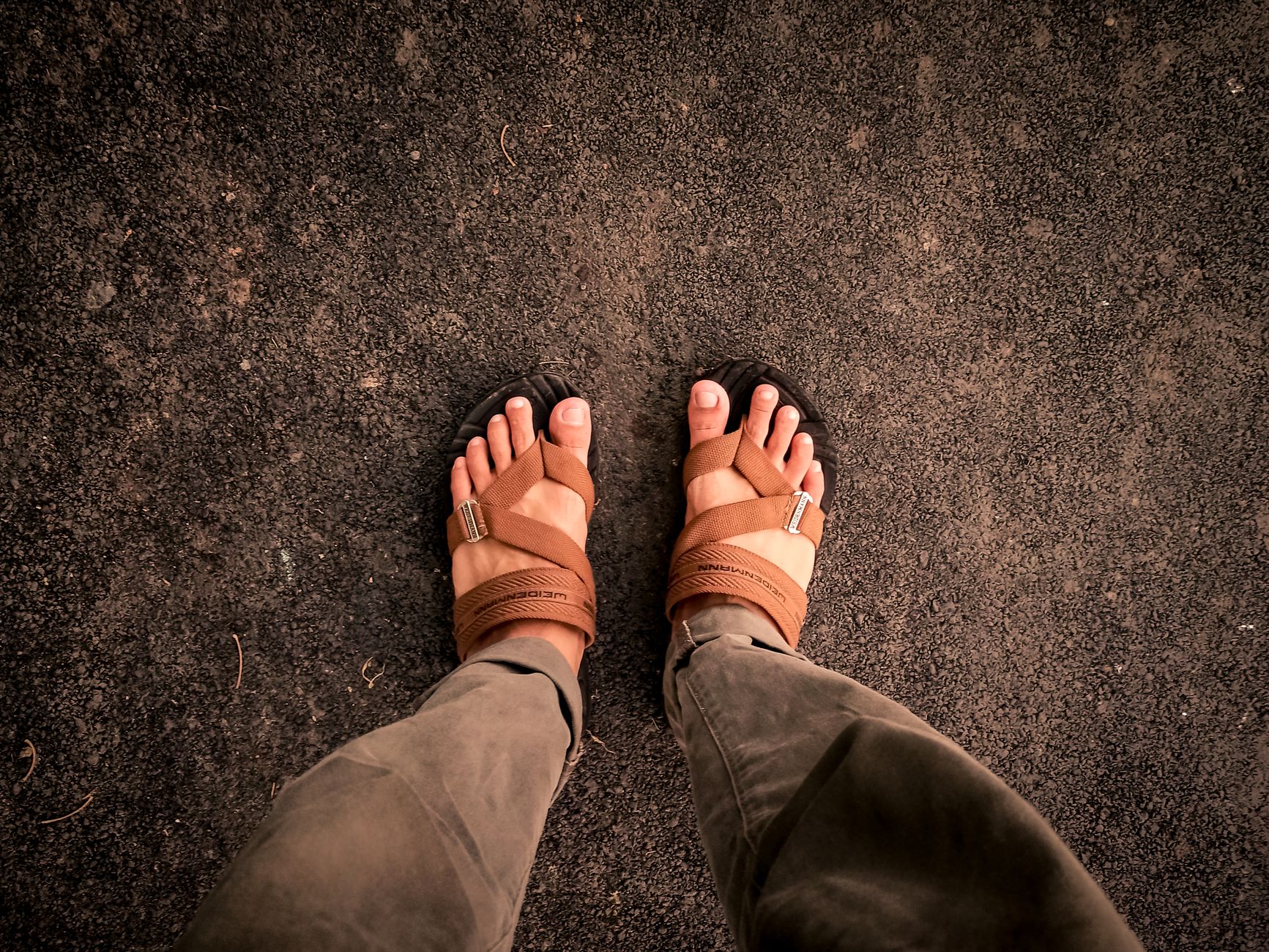 Woman wearing ribbon sandals paired with a flowy skirt outdoors