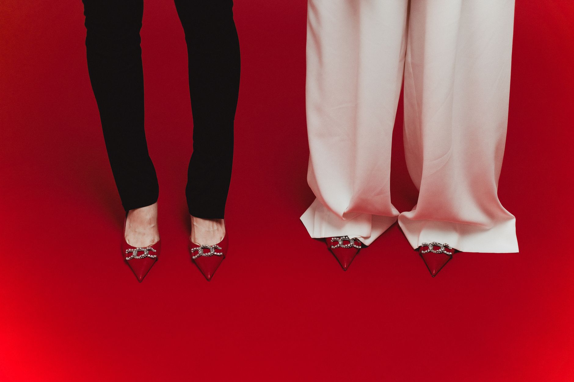 Editorial flat lay of wrap sandals and minimal summer footwear on a neutral surface