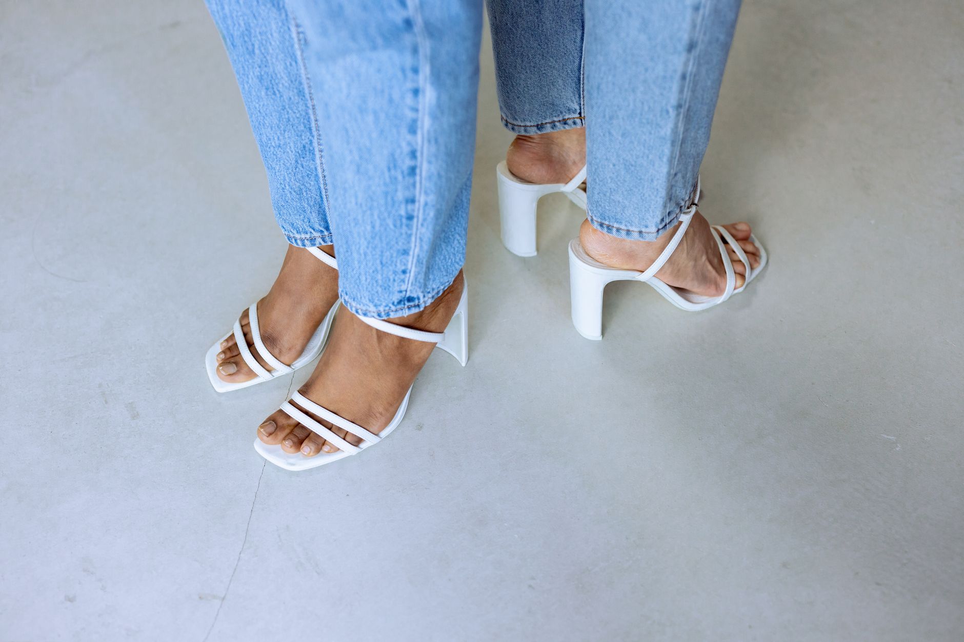 Close-up of sandals worn with casual summer fashion