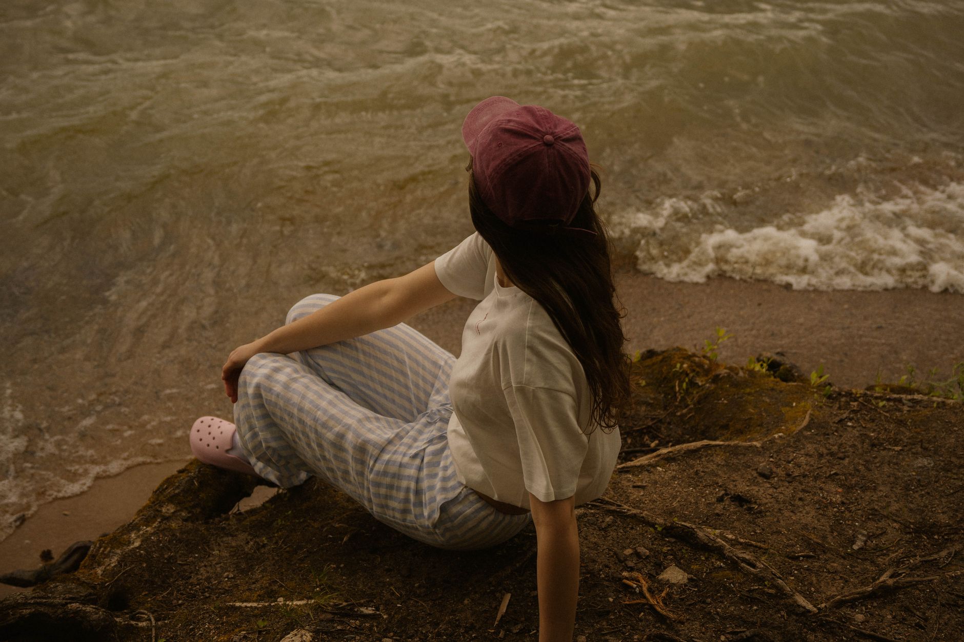 Model wearing fitted mid-calf length capri pants in a neutral fabric