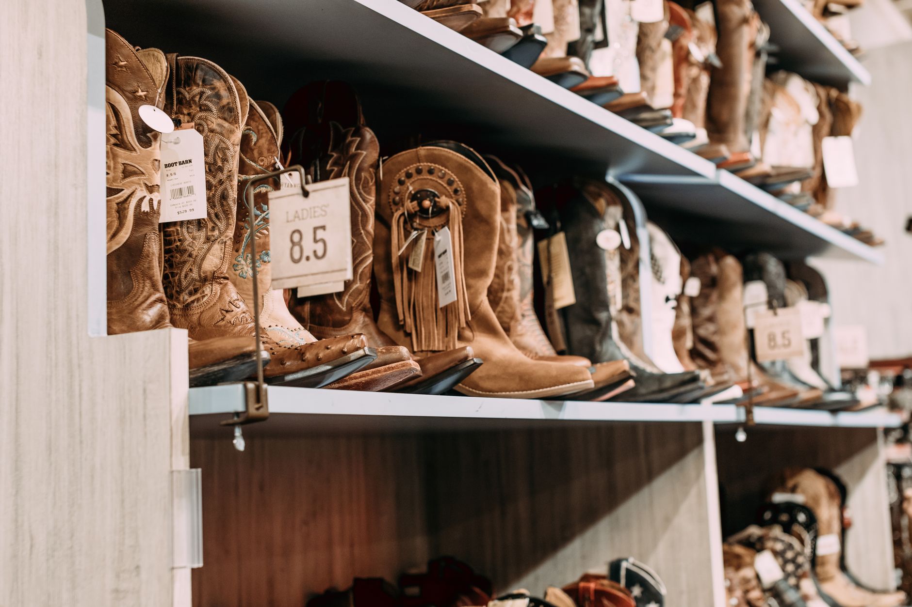 Sandals displayed on retail shelving in a fashion boutique