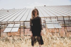 The Sheer Overskirt Is Quietly Edging Out the Wrap Skirt A model wearing a sheer chiffon overskirt layered over tailored trousers in a fashion editorial setting