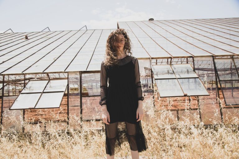 The Sheer Overskirt Is Quietly Edging Out the Wrap Skirt A model wearing a sheer chiffon overskirt layered over tailored trousers in a fashion editorial setting