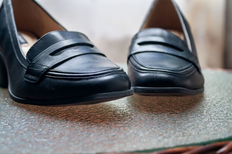 The Kitten Heel Clog Is Quietly Edging Out the Wooden Mule Close-up of a pair of low-heeled clogs in neutral leather on a clean surface