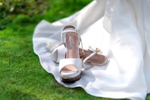 The Kitten Heel Sandal Is Quietly Edging Out the Strappy Flat Close-up of a kitten heel sandal on a light surface, showing slim heel detail