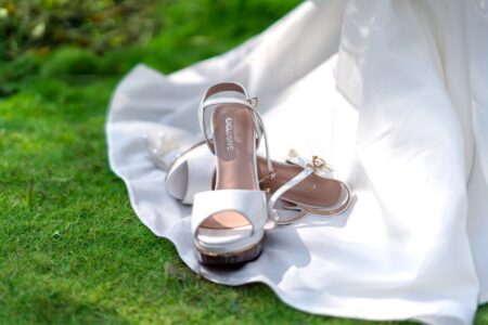 The Kitten Heel Sandal Is Quietly Edging Out the Strappy Flat Close-up of a kitten heel sandal on a light surface, showing slim heel detail
