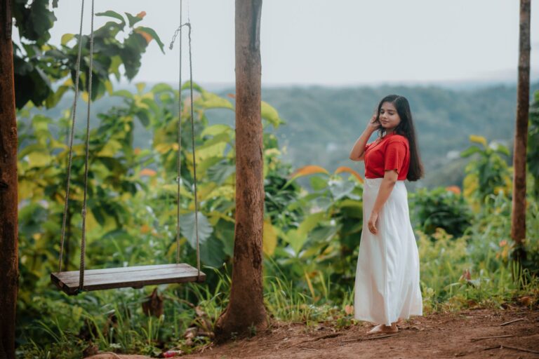 The Broderie Anglaise Maxi Skirt Is Quietly Edging Out the Pleated Midi Woman wearing a white broderie anglaise maxi skirt outdoors in natural light