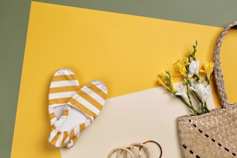 Close-up of raffia ballet flats in natural woven texture on a light surface