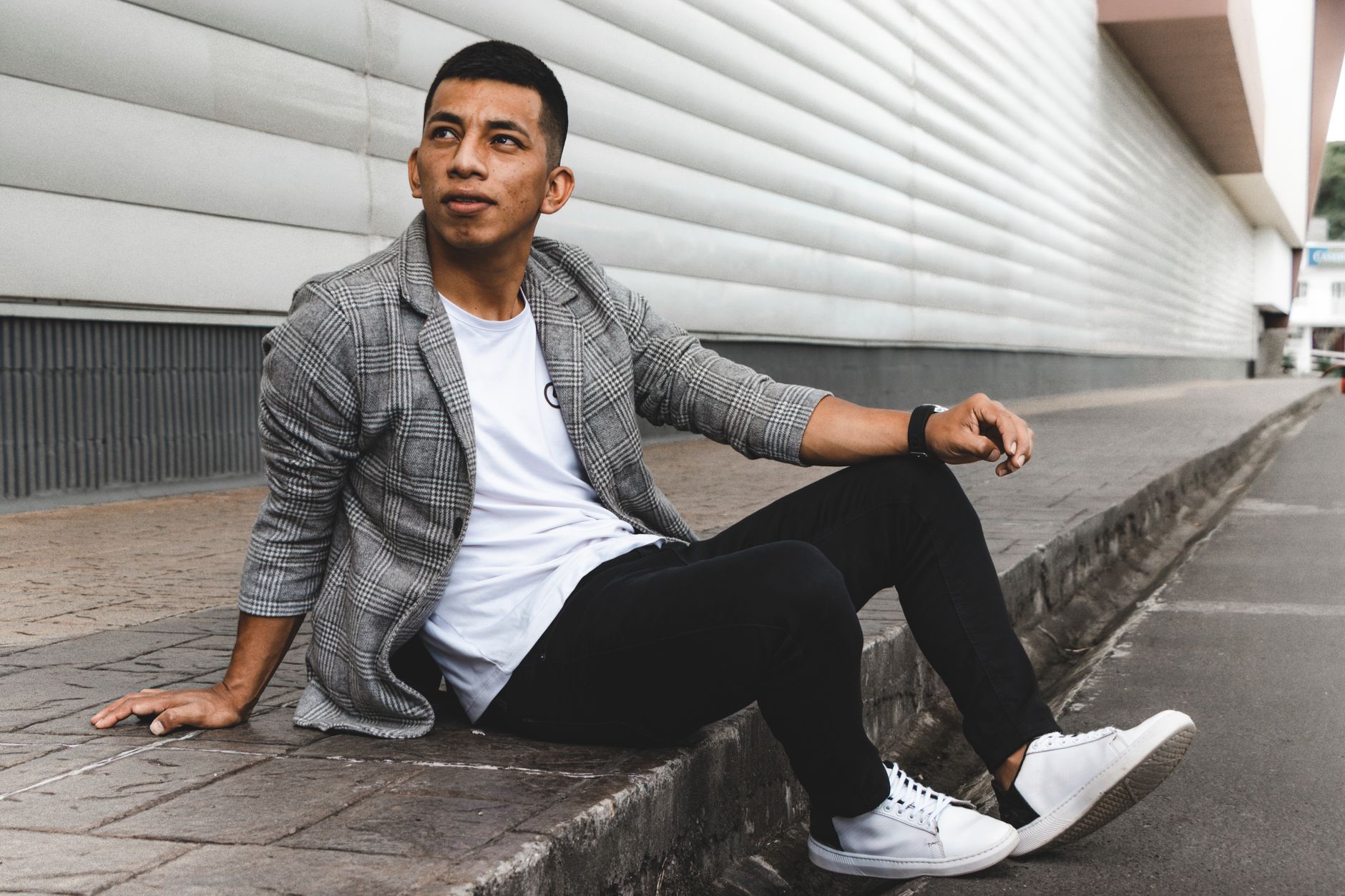 Man in relaxed smart-casual outfit featuring light-colored trousers and loafers