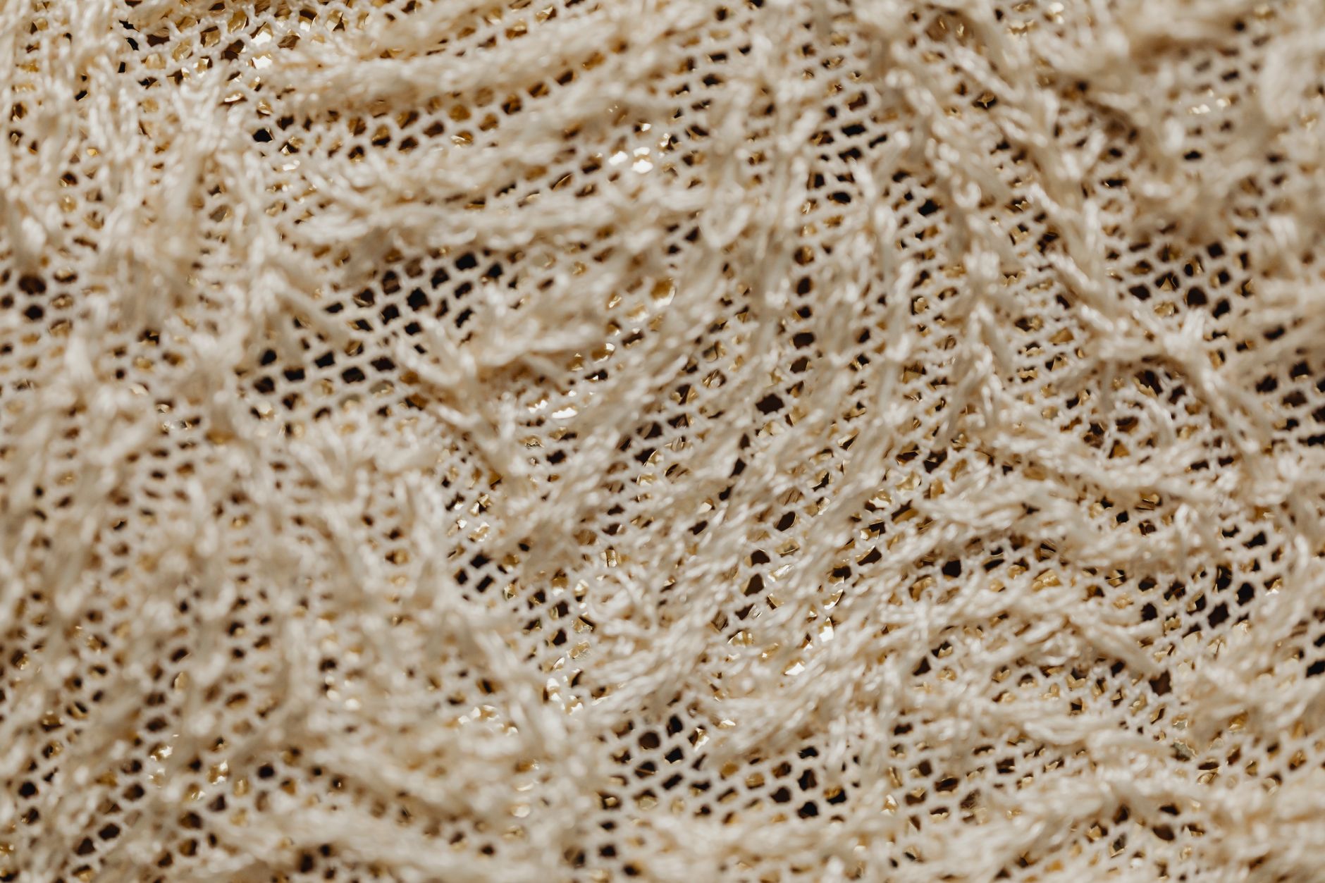 Close-up detail of white broderie anglaise eyelet fabric texture