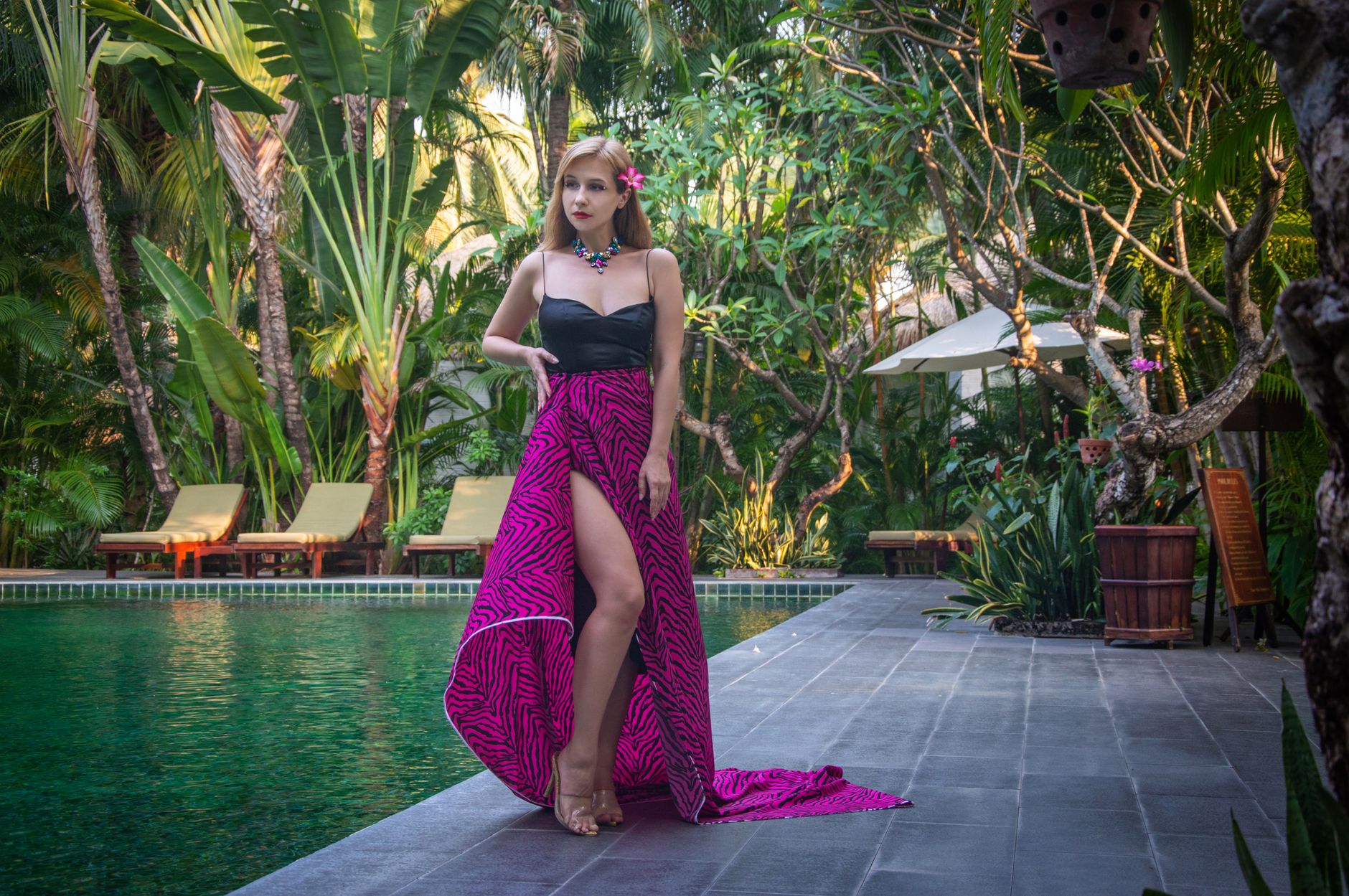 Summer resort outfit styled with natural accessories and white swimwear