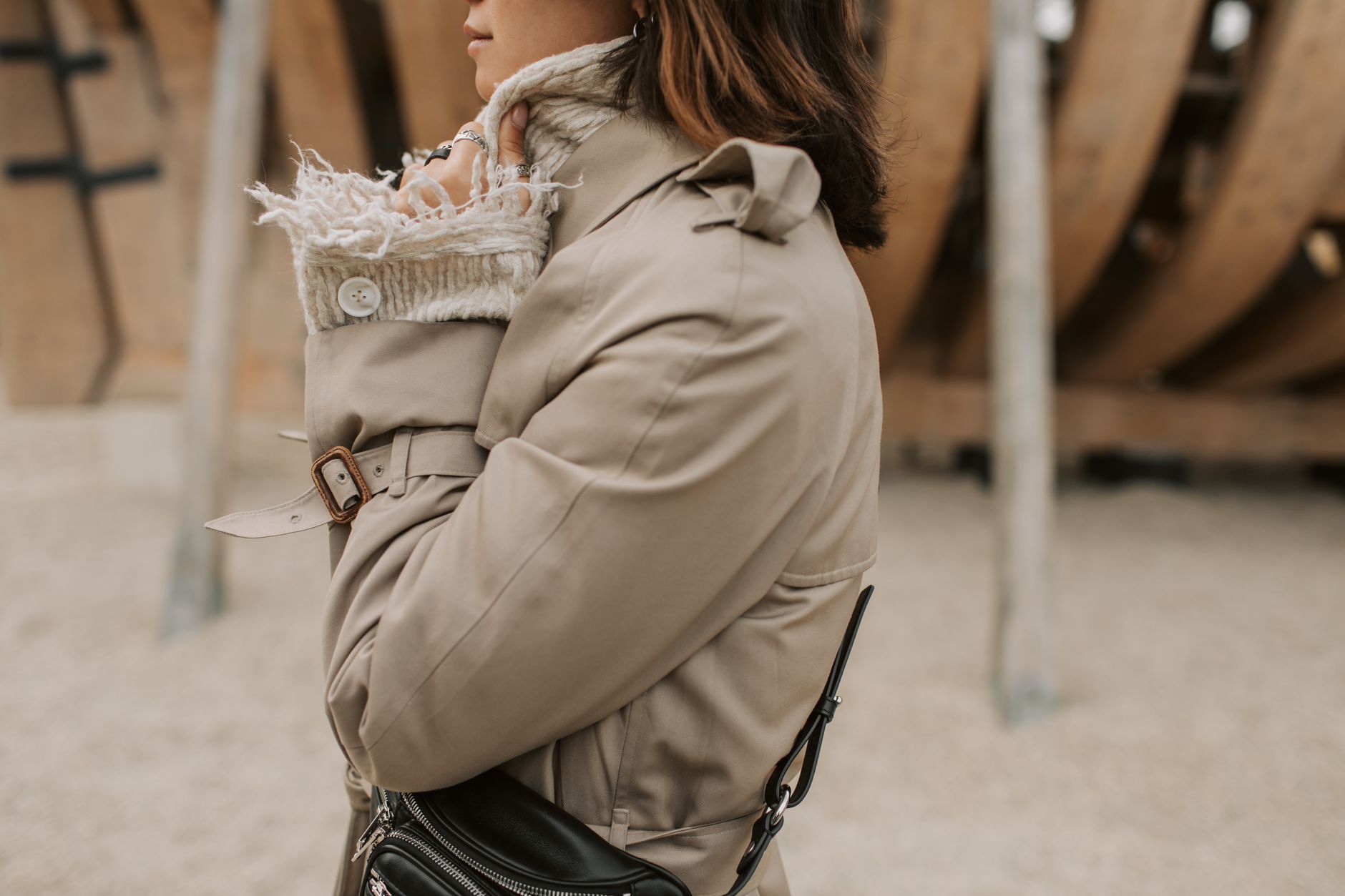 A woman styled in a layered fashion look with a translucent skirt over fitted base clothing