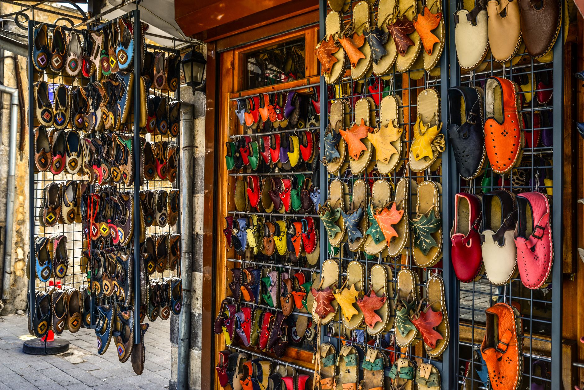 A selection of women's sandals arranged on a retail display shelf