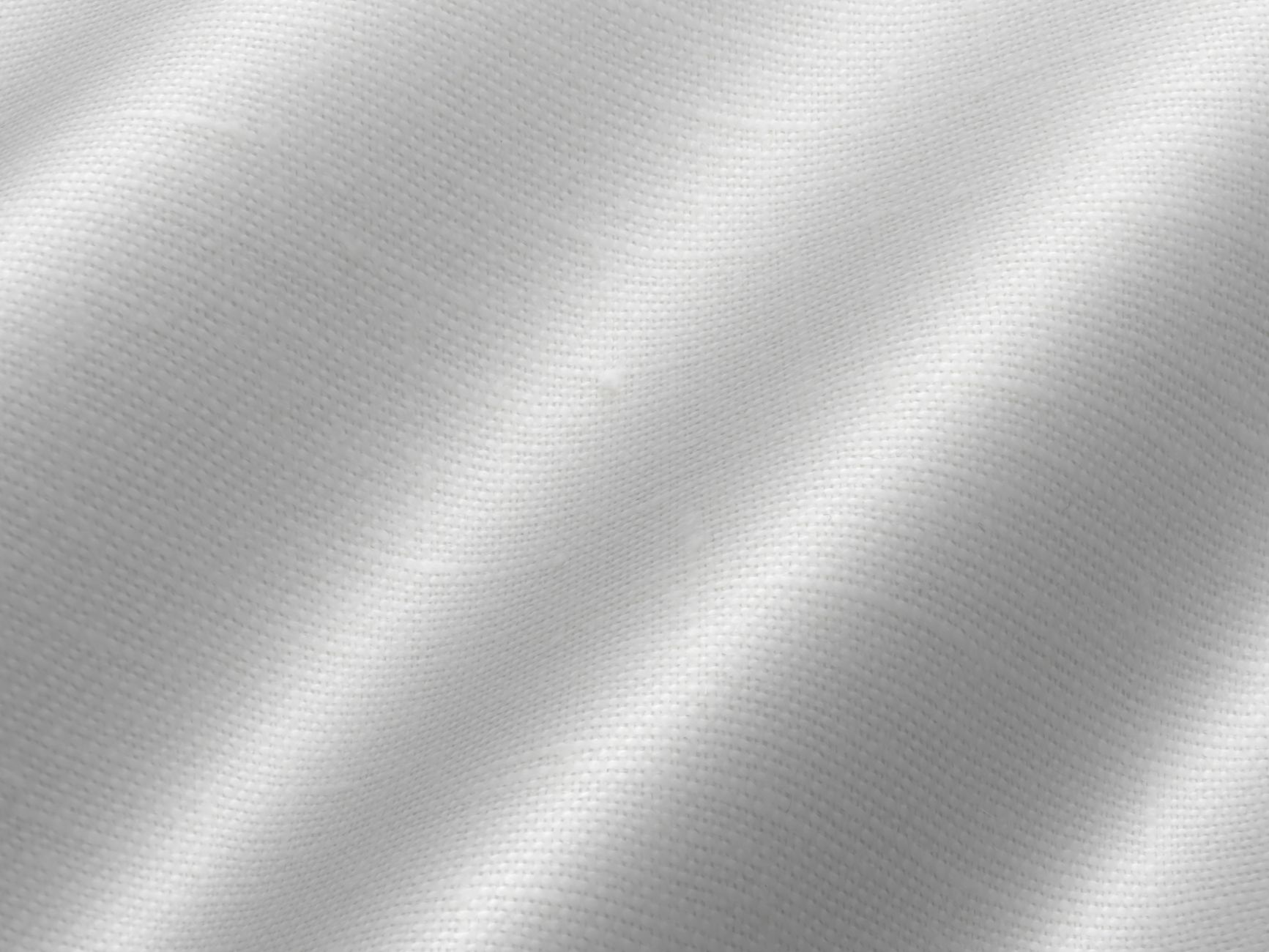 Close-up of broderie anglaise eyelet cotton fabric texture in white