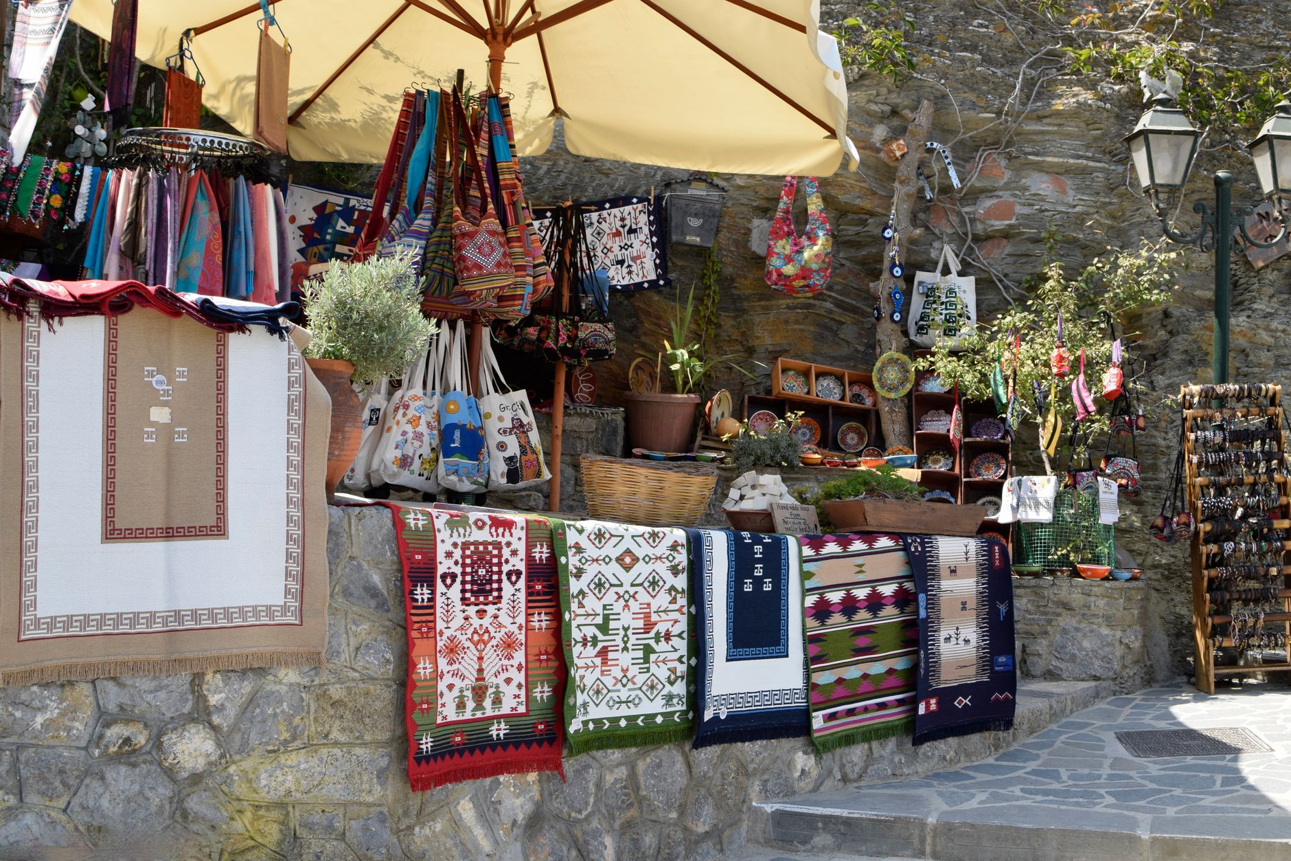 A collection of woven and textured summer tote bags in neutral and earthy tones