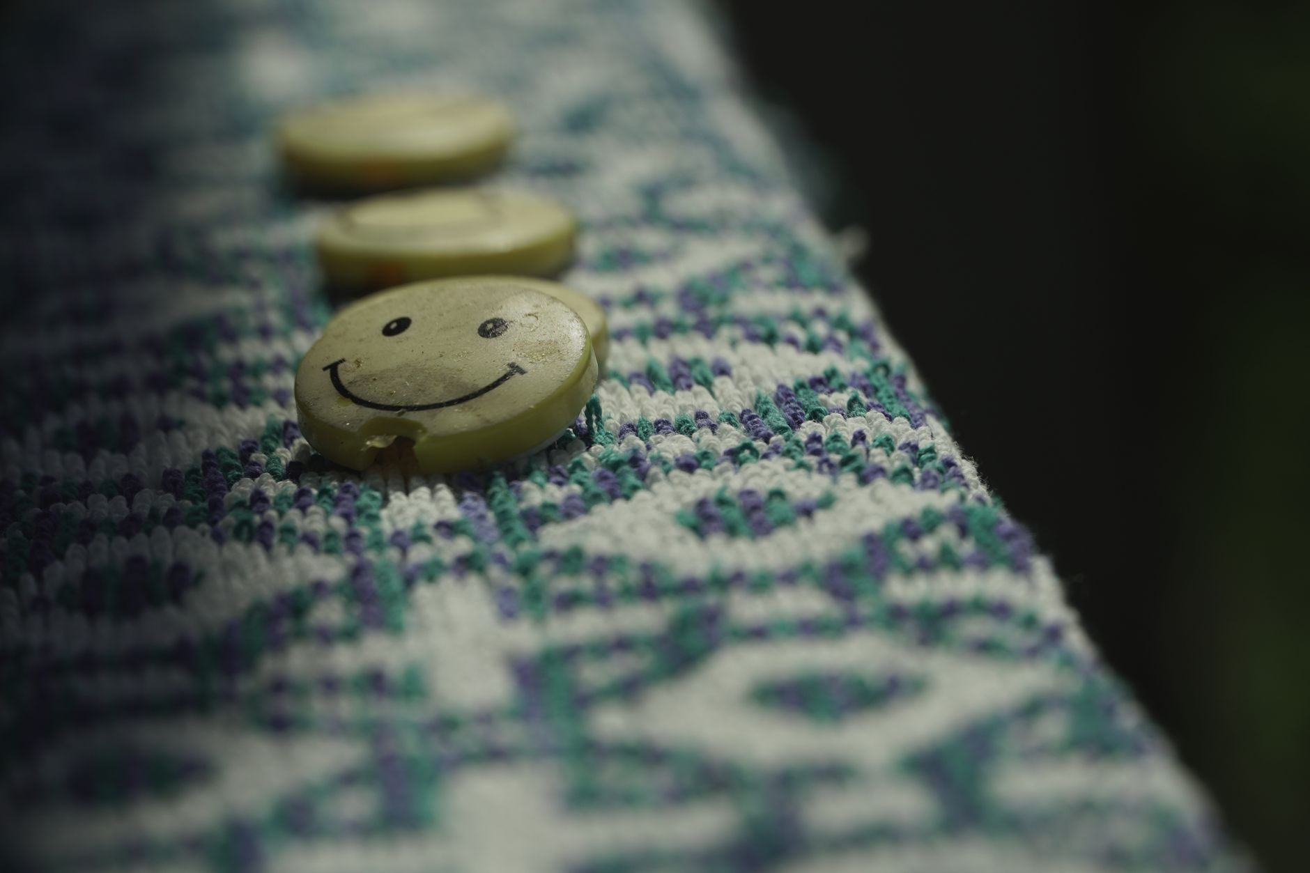 Close-up detail of broderie anglaise eyelet fabric texture in white cotton