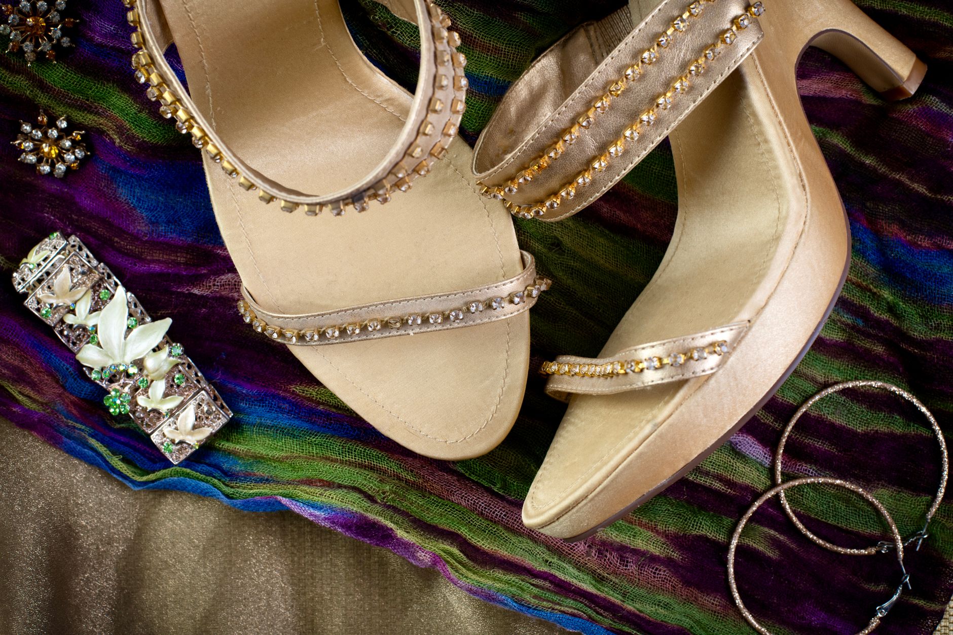 Close-up of strappy T-strap sandals showing detailed strap construction