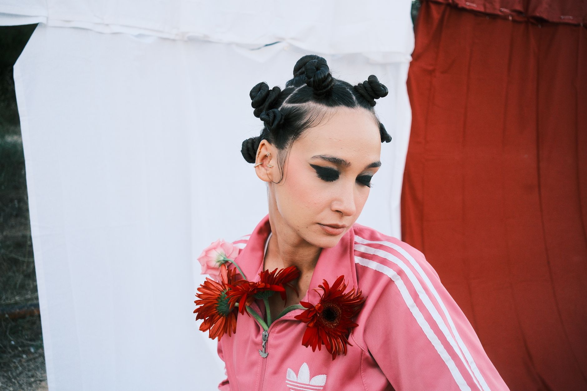 Stylish woman with a fabric headband completing a composed, tailored look