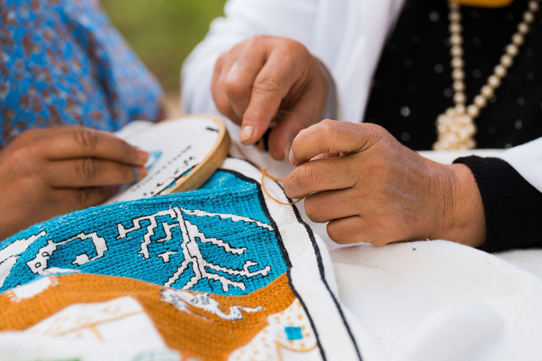 Close-up of broderie anglaise embroidered fabric with decorative cutwork pattern