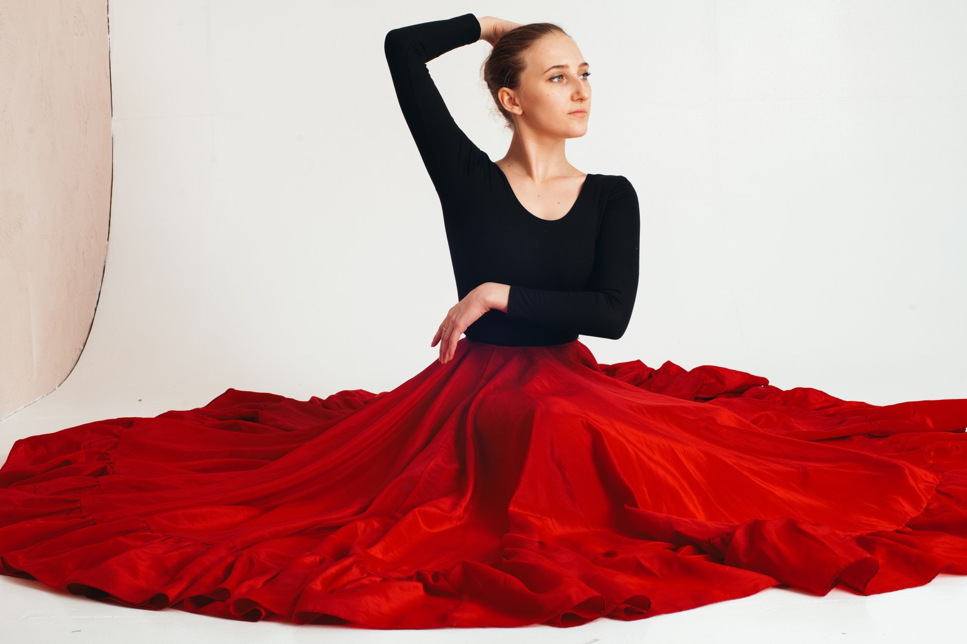 A flowing sheer skirt photographed in a studio setting showing fabric movement and texture