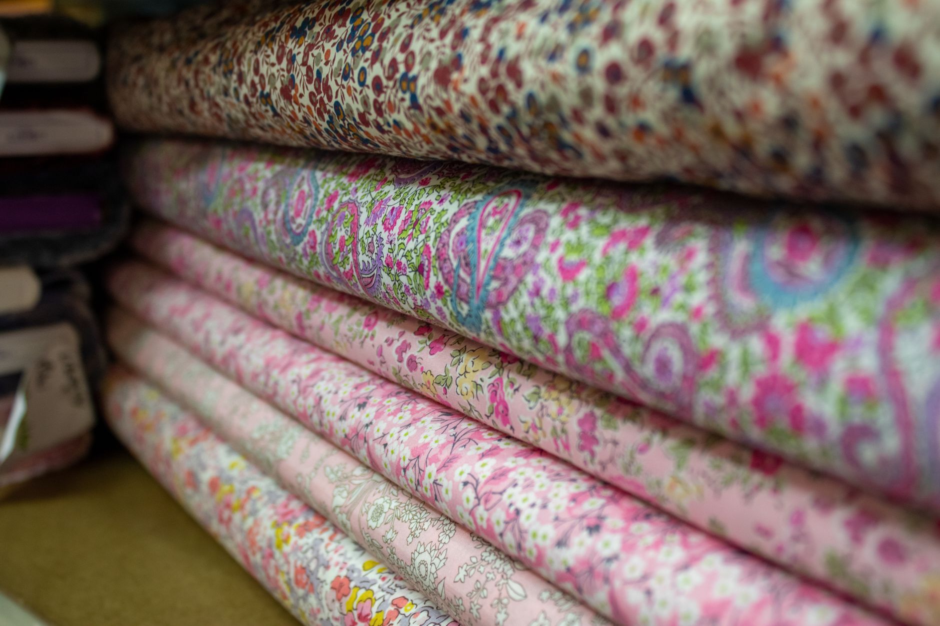 Close-up of white broderie anglaise fabric showing eyelet embroidery texture