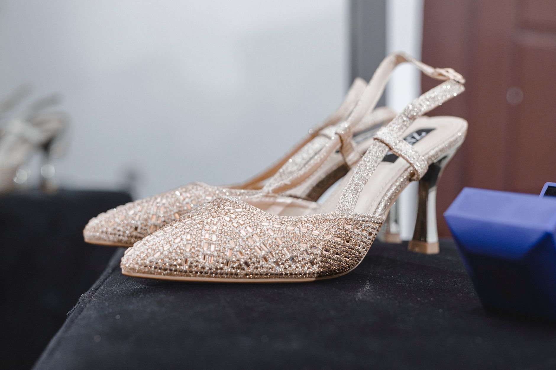 Elegant flat shoes arranged on a fashion display surface